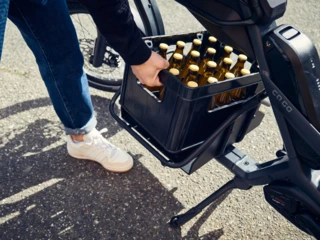 Hand getting beer out of center rack of CS